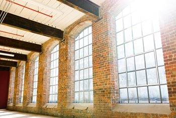 Original 12 foot tall windows provide plenty of natural light at these greensboro apartments